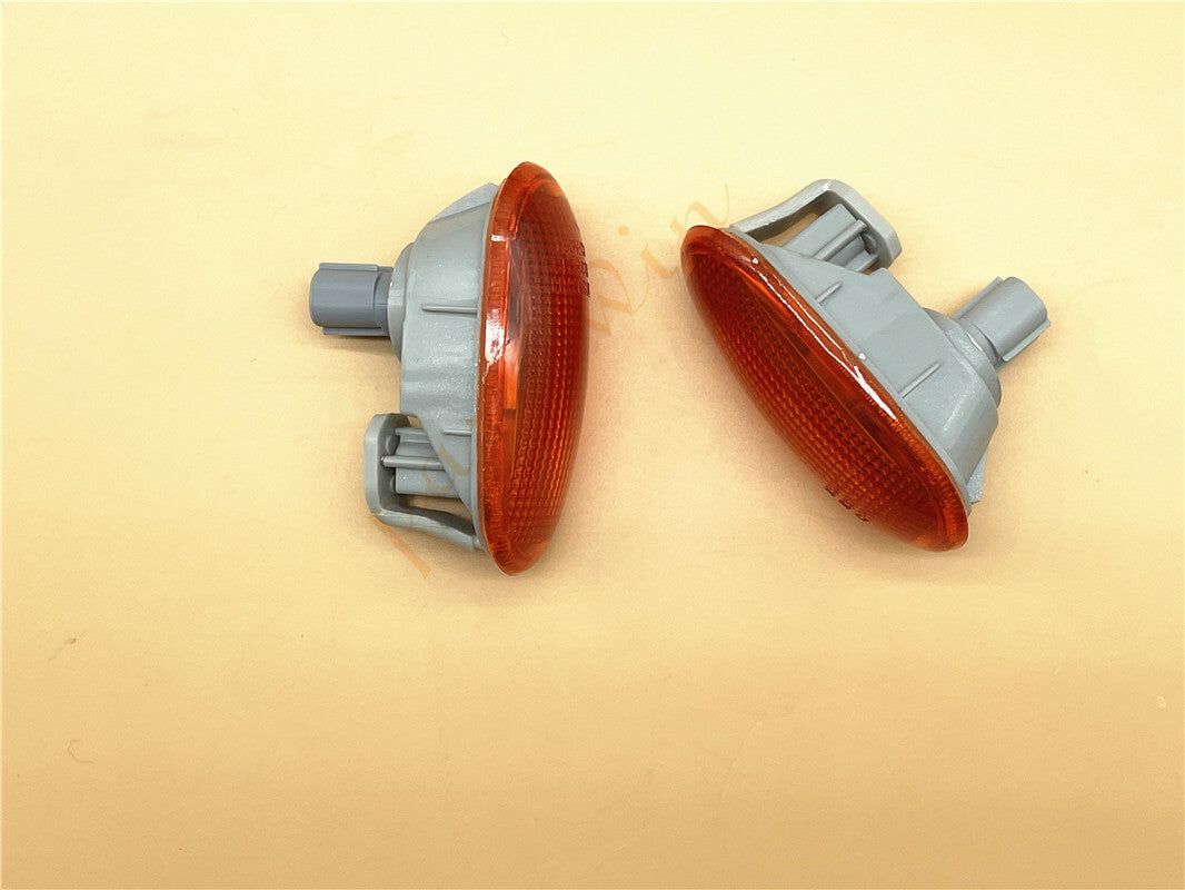 A pair of amber parking lights and bulbs suitable for Mitsubishi Mirage 1992-2000