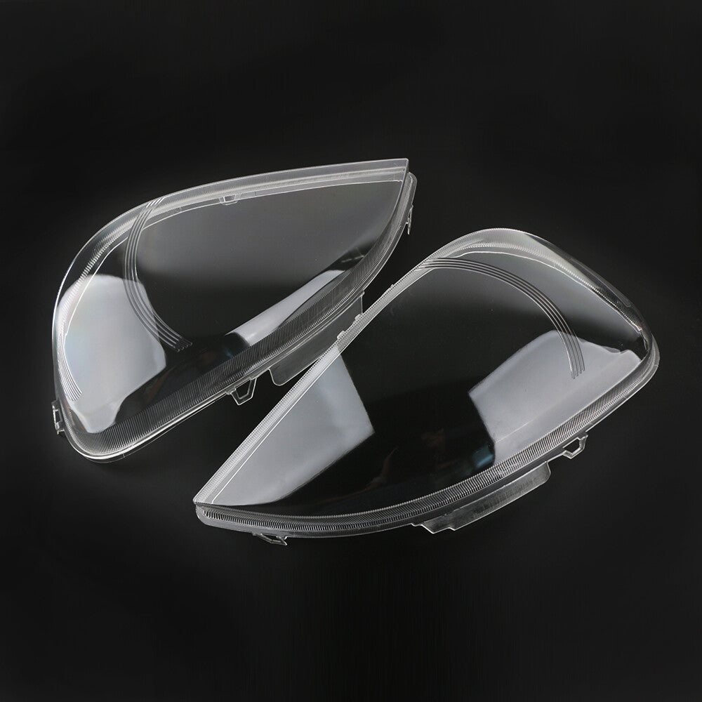A pair of headlight lens covers for Mercedes-Benz W163 ML-Class 2002-2005.