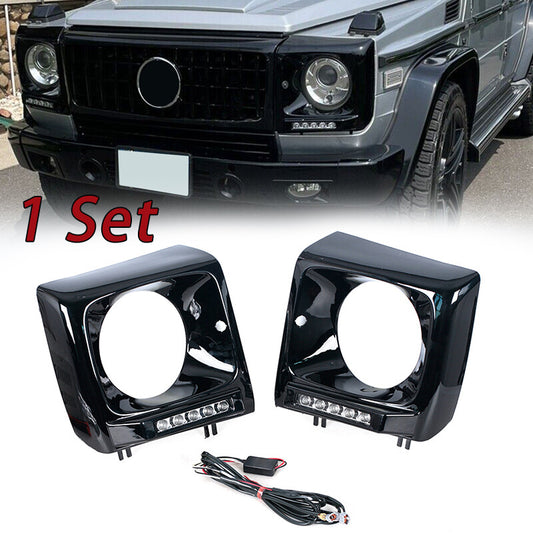 pair of black headlight bezels for the 1990-2018 for Mercedes W463 G63 Wagon G500 with LED DRLs.