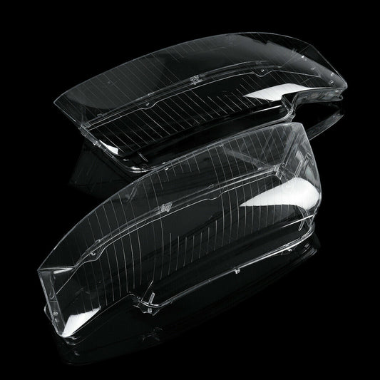A pair of clear lens covers for left and right headlights, suitable for Audi A4 and B6 models from 2002 to 2005.