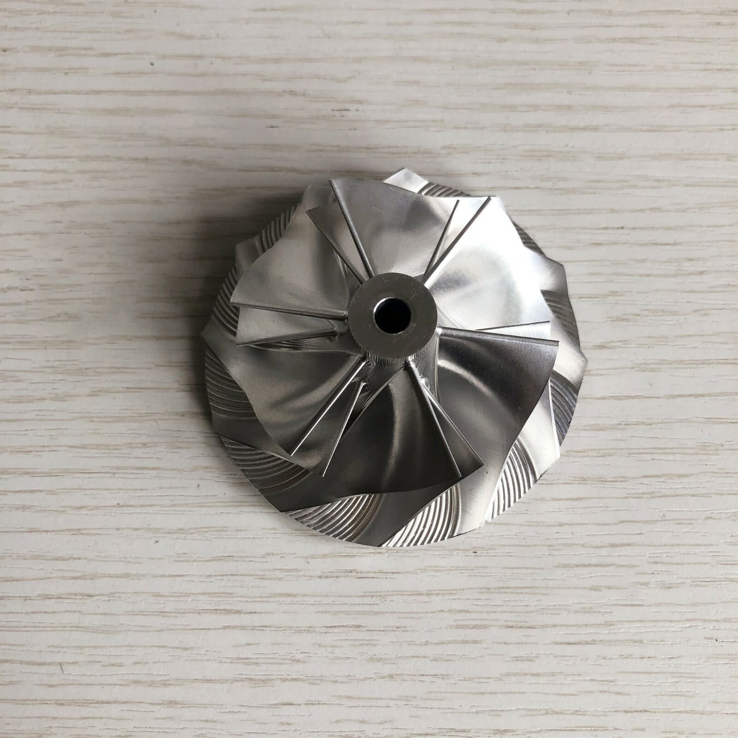 GT3037 Reverse 6+6 Blade 57.04/76.13 mm Bore: 5.99 mm Billet Compressor Wheel